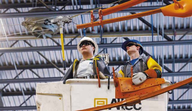 North Dakota electric cooperative lineworkers participate in hotline school at the Lineworker Training Center in Mandan in May 2025. The essential training prepares apprenticeship and journeyman lineworkers to safely work on energized power lines. Photo provided by NDAREC.