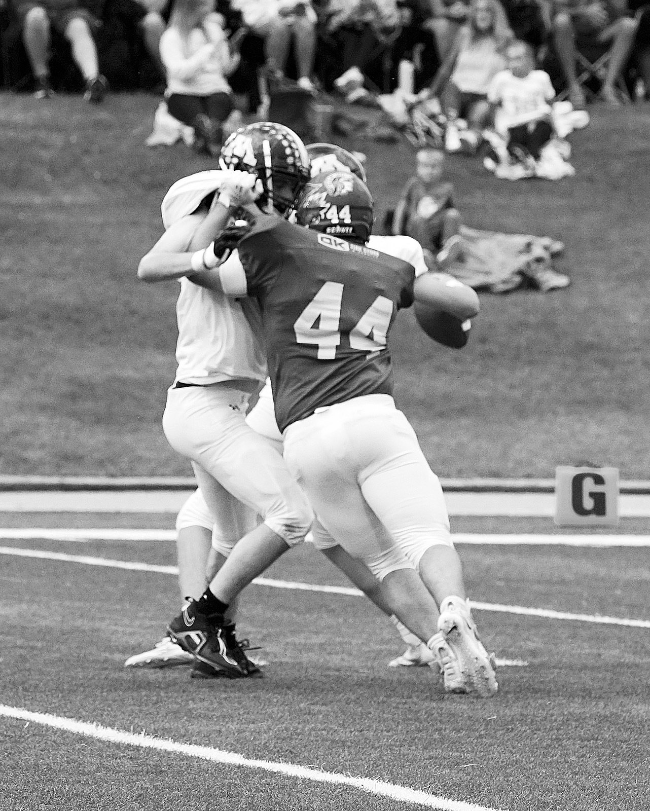 Cole Welsh puts pressure on the West Team's wuarterback in the Shrine Bowl. Photo by Larry Stokke.