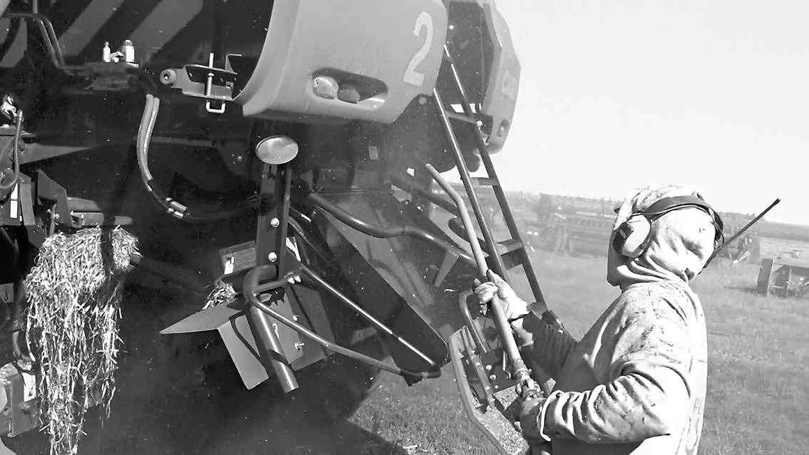 Use an air compressor or leaf blower every day when the machine is off and cooled down to remove dirt, dust, chaff and other plant residue that has accumulated. (NDSU photo)