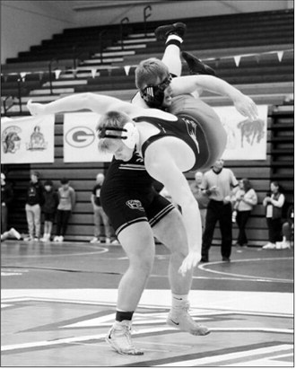 Gavin Symington gives his opponent a good look at the mat then went on to win the match with a pinfall. Photo by Larry Stokke