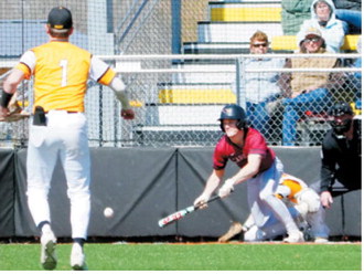 Sam Davis lays down a bunt to bring in a run during the Cardinals’ win over Park River on May 7 in Park River. Photo by Larry Stokke