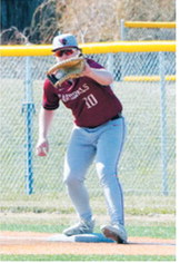Devin Hakanson records an out with a catch at first base against the Aggies. Photo by Larry Stokke