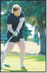 Stella Busse tees off during the Langdon Invitational on Monday, Aug. 24. Busse finished second with a score of 97. Photo by Larry Stokke