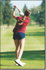 Lily Zimmer watches her tee shot during the Langdon Invitational on Monday, Aug. 24. Photo by Larry Stokke