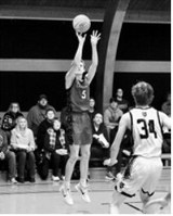 TJ Henderson drops on a long 2-point shot in Crystal on Jan. 20 against the Titans. Photo by Larry Stokke