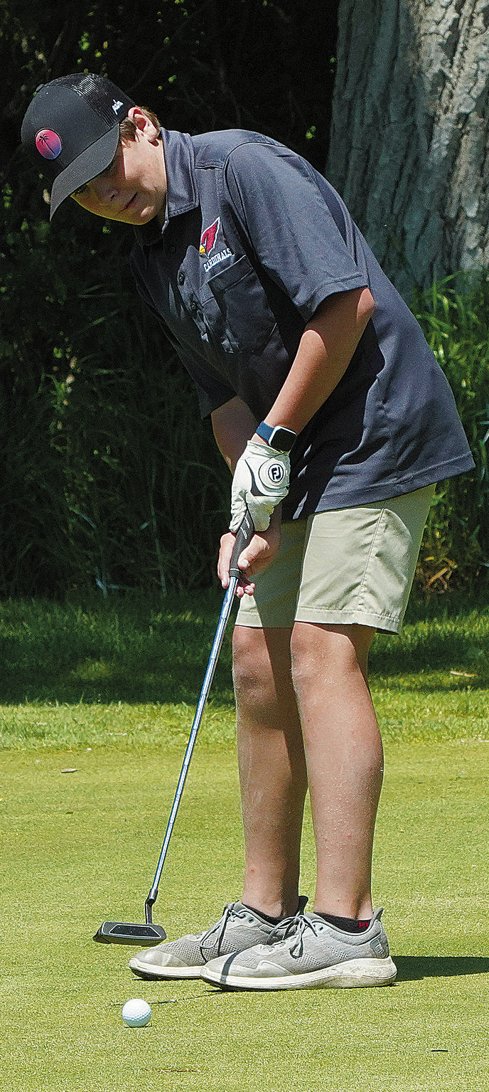 Langdon Cardinal, Ryder Moser, putting at the state golf meet. Photo by Larry Stokke.