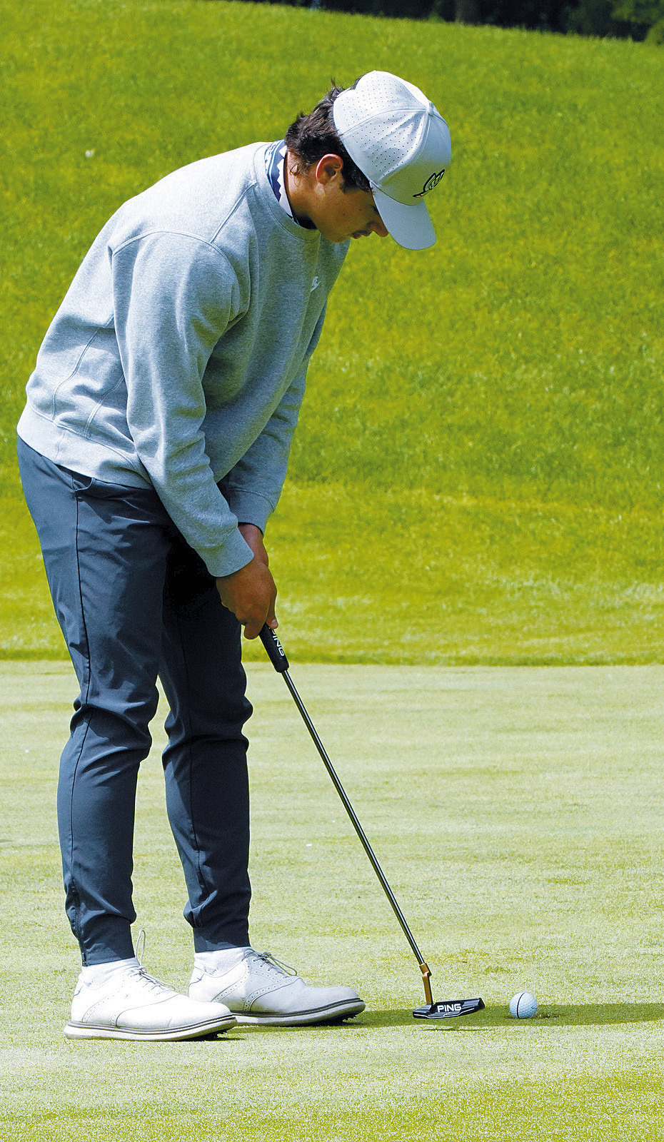 Grant Cosley sinks one in the hole while playing for the Eagles at state. Photo by Larry Stokke.