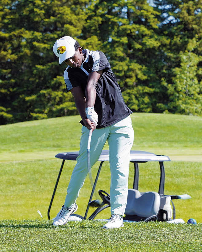 Gabe Symington representing North Border at state golf. Photo by Larry Stokke.