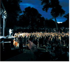 Festivalgoers gather near the stage as musicians perform during Off the Charts. Photo by Larry Stokke