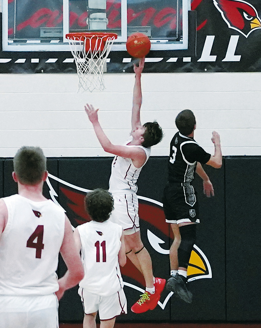 Eastyn Schaefer drops in a layup to add to his team high 16-point night. Photo by Larry Stokke.