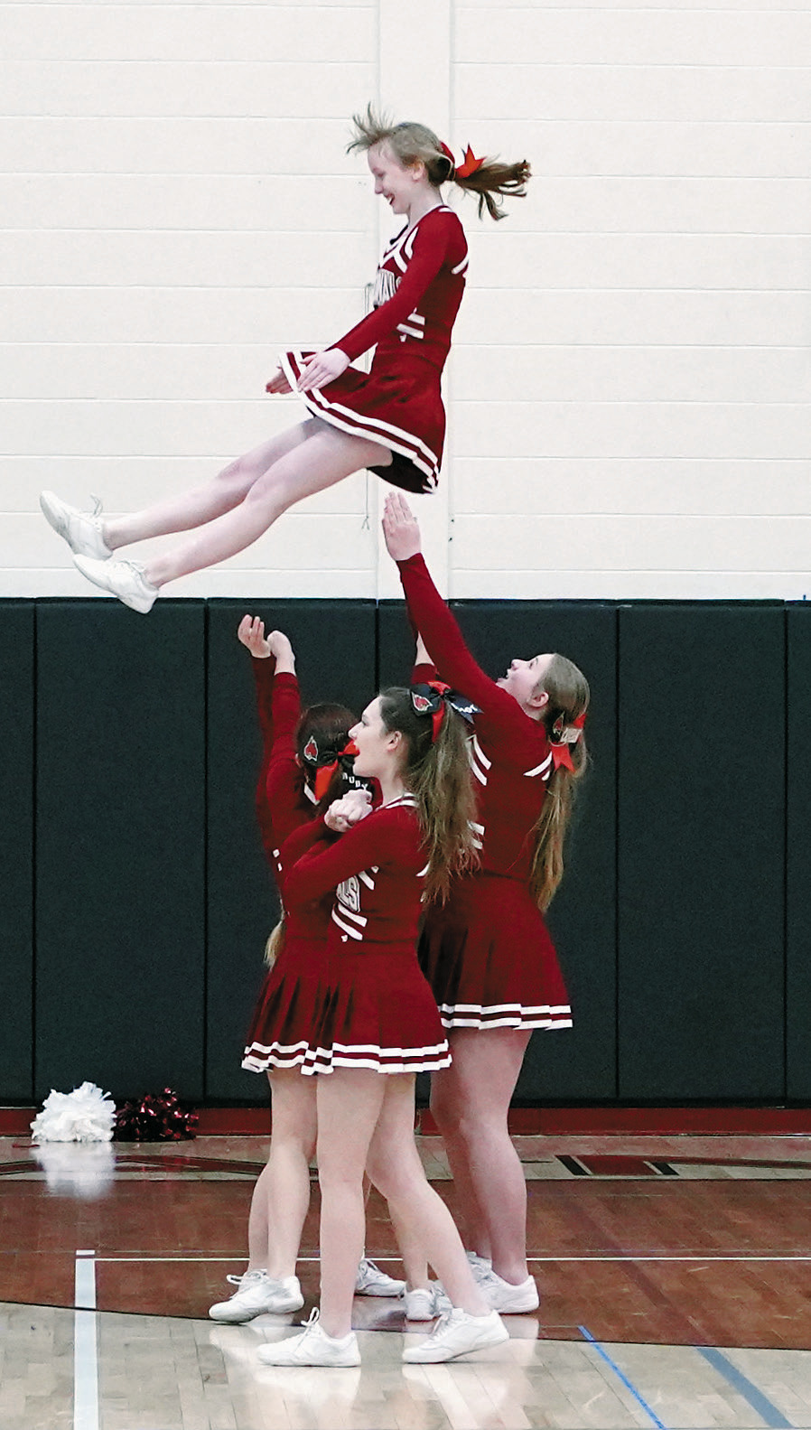 The Cardinal Cheerleaders once again kept the Cardinal fans fired up cheering the boys on to a win. Photo by Larry Stokke.