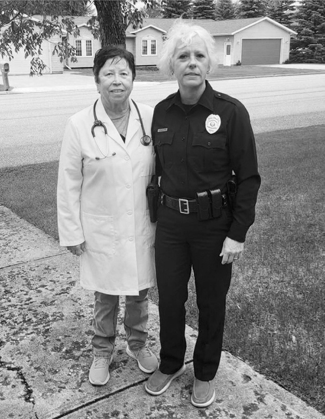Dr. of Dermatology Val Olson and Police Officer Jackie Dvorak waiting for Bob