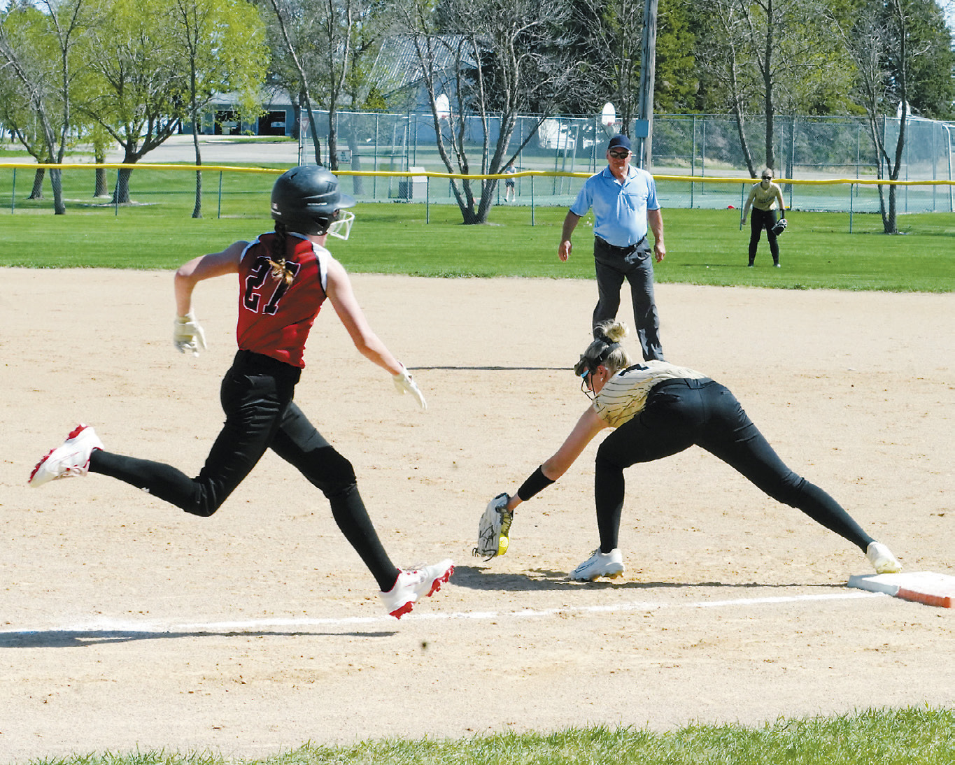 Hannah Russell with a catch at first base just in time to tag Lily Zimmer out in Munich on May 12. Photo by Larry Stokke.