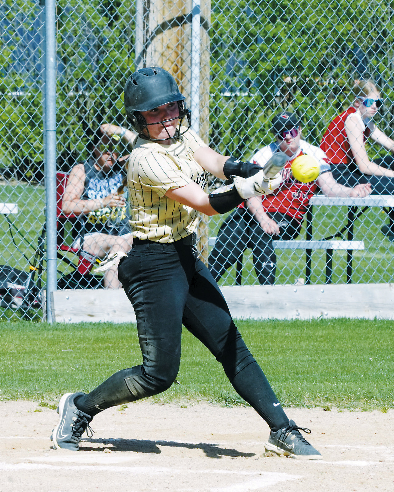 Remi Larson connects for a base hit against the Cards. Photo by Larry Stokke.