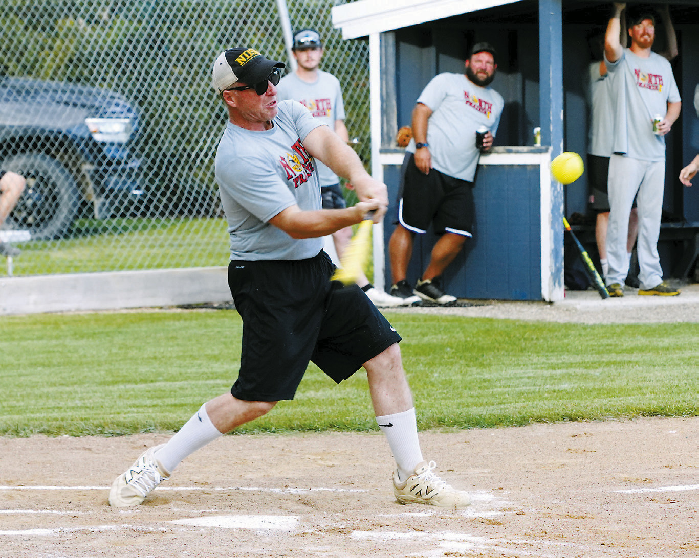 Aaron Johnson drives one into the outfield for a base hit in the Legacy Alumni Tournament where Langdon, Munich, and Edmore competed against one another. Photo by Larry Stokke.