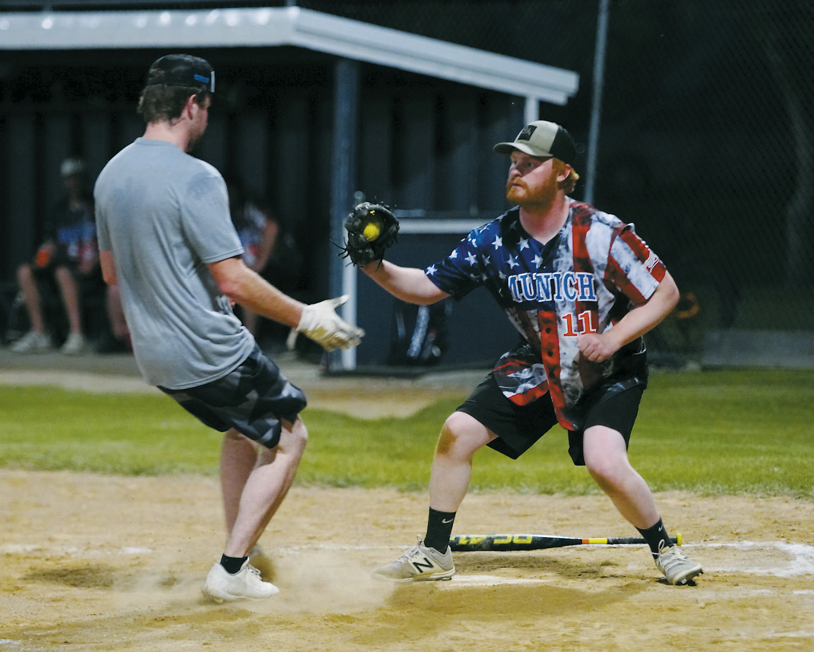 Braden Harder tags out a runner at home base during the Legacy Game hosted on Aug. 7. Photo by Larry Stokke.
