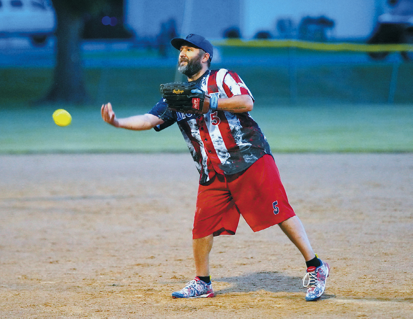Jesse Goeser sends a strike across the plate during the Legacy Alumni Softball Tournament. Photo by Larry Stokke.