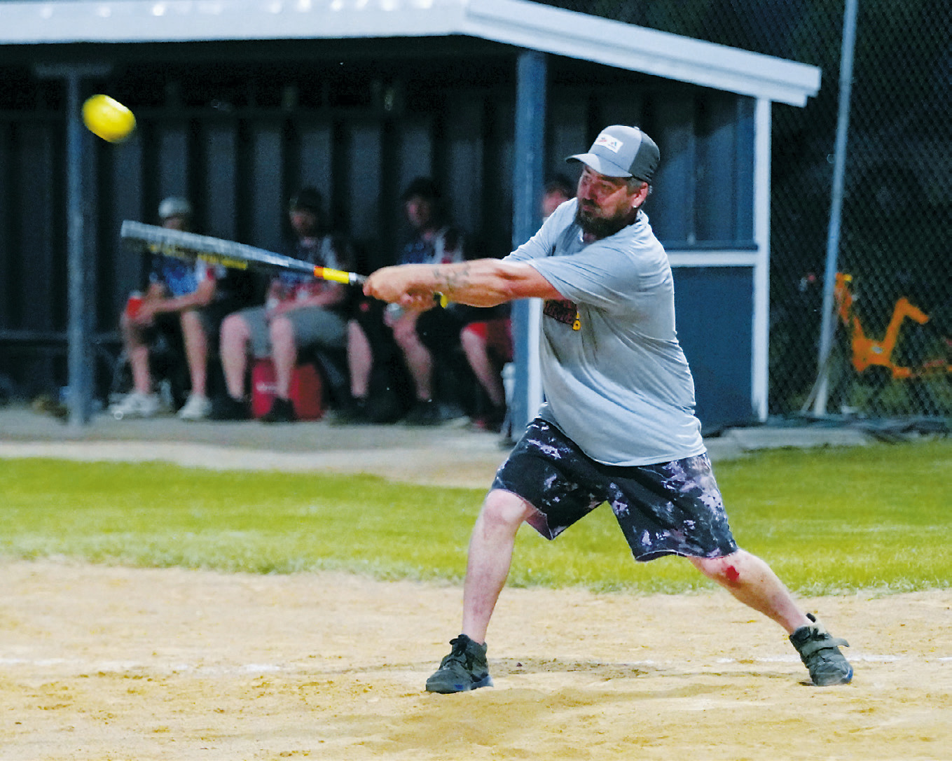 Dylan 'Dill Pickle' Johnson makes contact for a base hit at the tournament on Aug. 7. Photo by Larry Stokke.
