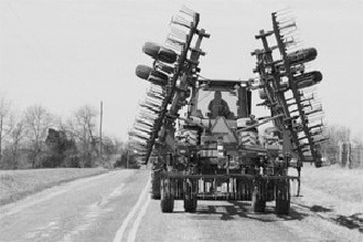 The responsibility of safely sharing the road during spring planting season falls on both farm equipment operators and general motorists. (Upper Midwest Agricultural Safety and Health photo)