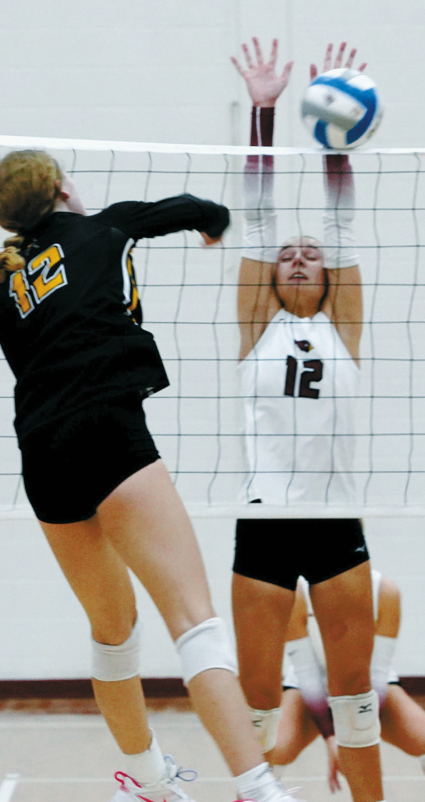 Kemi Morstad stuff blocks Aggie Lauren Bell. Photo by Larry Stokke.