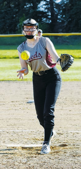Graci Witzel sends a strike to a Midway/Minto player in Crystal on July 2. Photo by Larry Stokke.