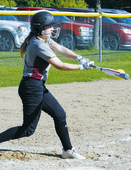 Kadence Wirth with a solid hit to the outfield gets on base. Photo by Larry Stokke.