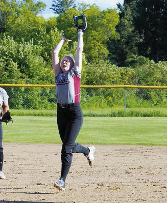Graci Witzel catching a pop fly in the Reds win over Midway/Minto. Photo by Larry Stokke.