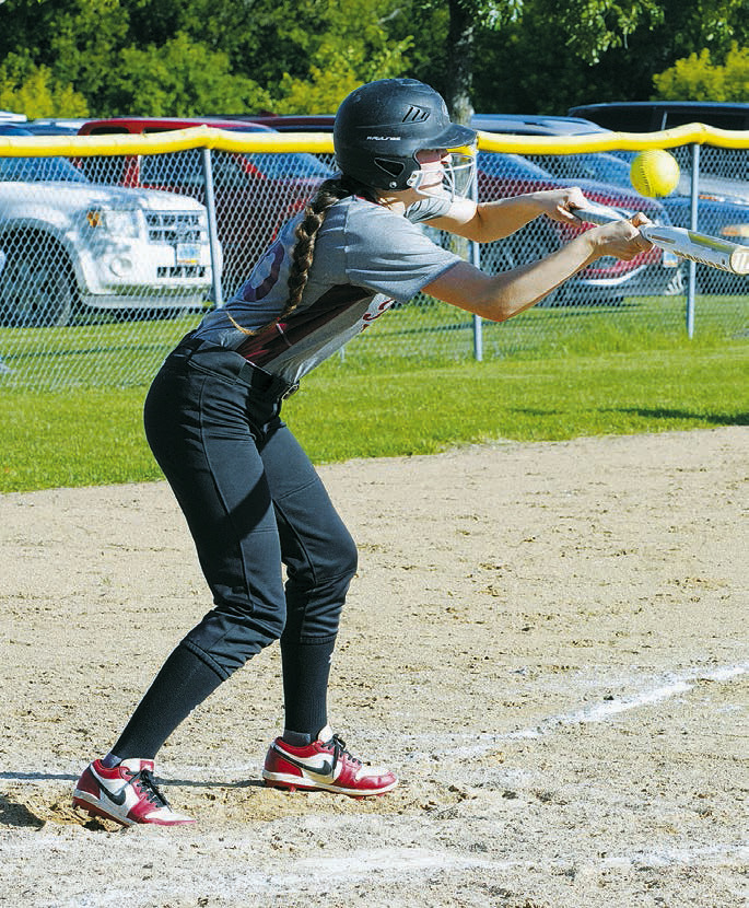 Bridget Pankratz with a bunt to advance a teammate. Photo by Larry Stokke.