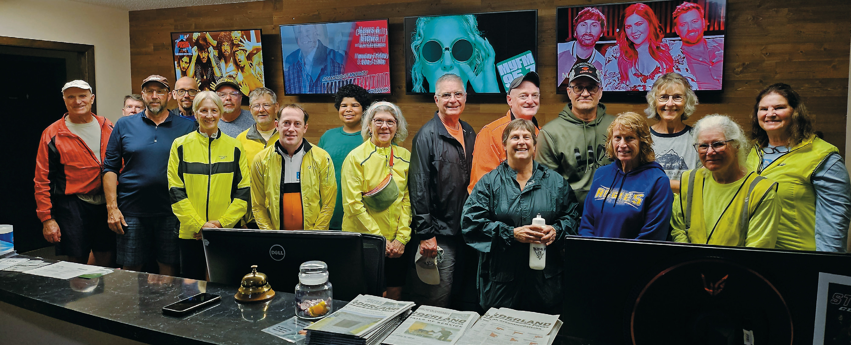 The CanDak cycling group touring the offices of Simmons Multimedia as a part of their week-long adventure through Pembina, Walhalla, Langdon, Graham’s Island, Park River, and Hallock. Photo by Nick Vorlage.