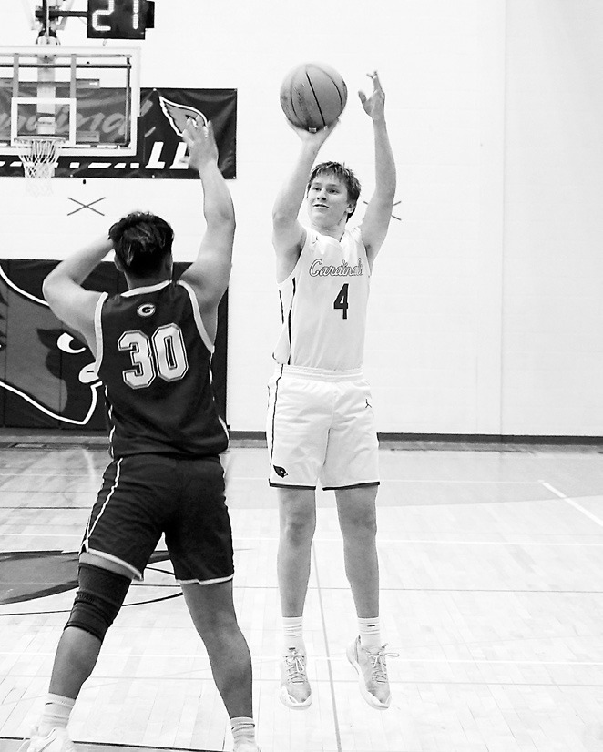 Levi Swanson drains a 3-point bucket against the Grafton Spoilers. Photo by Larry Stokke.