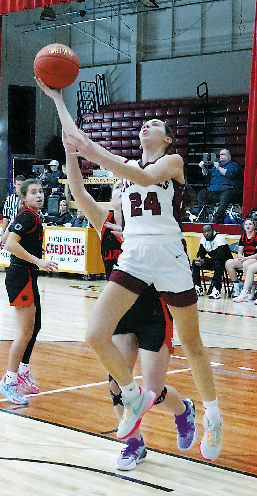 Avery Lorenz goes up for a shot. Photo by Larry Stokke.