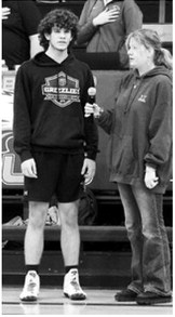Bryce Carignan and Gracyn Hornung did a fantastic job singing the National Anthem at the wrestling meet in Walhalla on Feb. 3. Photo by Larry Stokke