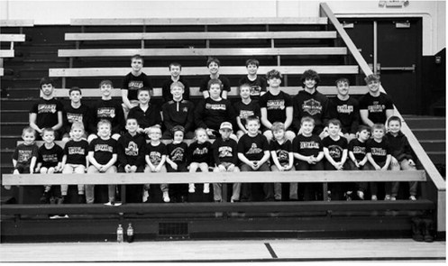 The Grizzly wrestlers were introduced before the meet with their Wrestling Buddies. Photo by Larry Stokke