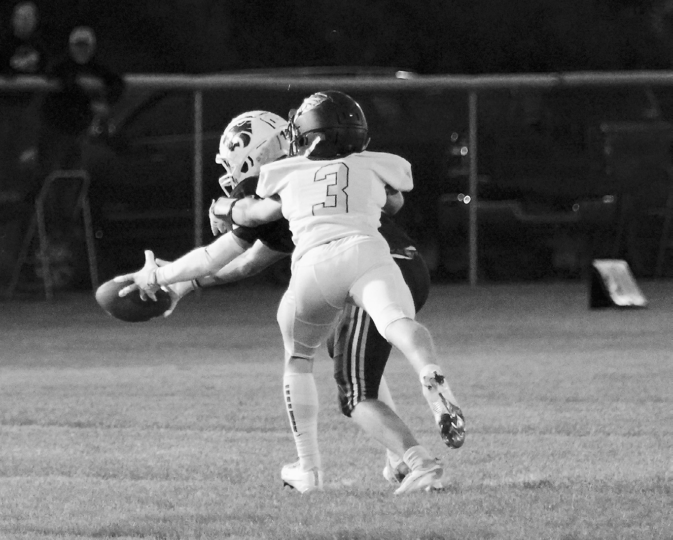Oakley Brown gets his hands on a Cougar's arm and causes him to fumble the ball, stopping him from making any yardage gain in the game on Aug. 22. Photo by Larry Stokke.