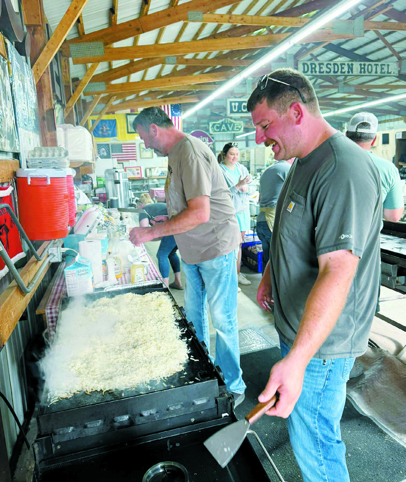 Reily and Mark working on hash browns for the Father’s Day Breakfast. Photo by Shauna Schneider.