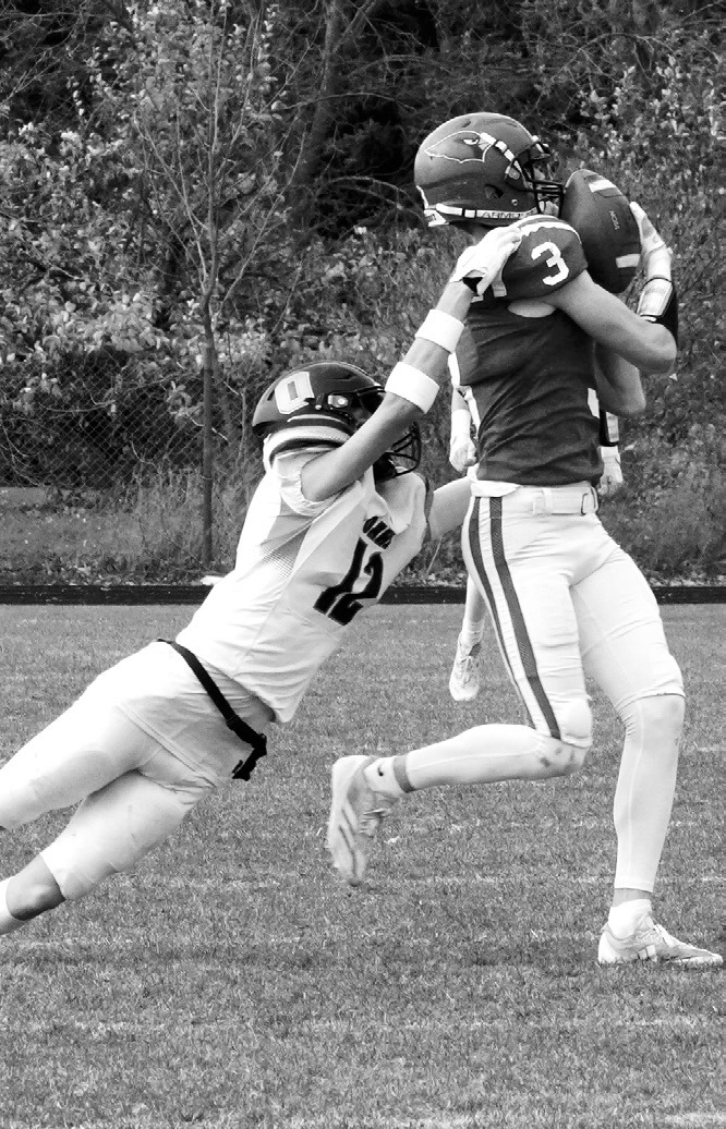 Cody Amble escapes being tackled by an Oakes player and runs 61-yards for a TD. Photo by Larry Stokke.