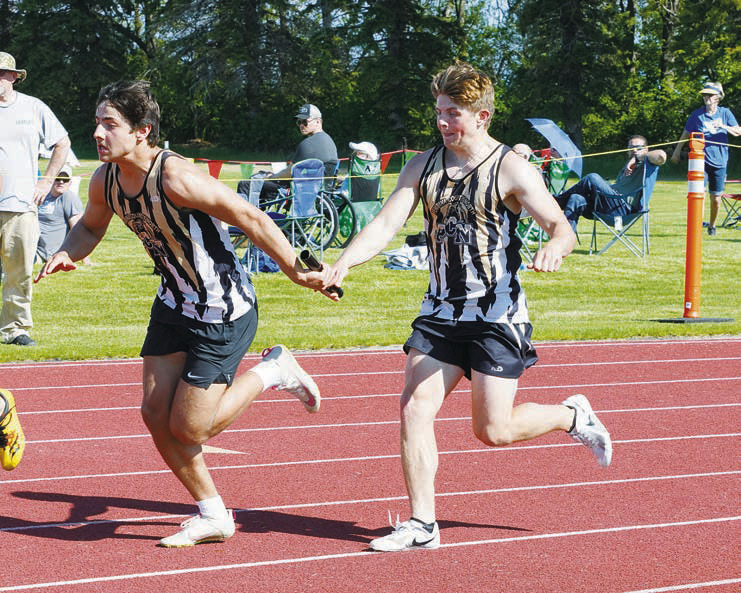 The relay team consisting of Weston Cosley (photographed left), Tage Holmquest (photographed right), Kade Schafer and Jesse Eisenbeis qualified for state in the 4X100M relay and the 4X200M relay. Photo by Larry Stokke.