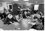 The residents enjoy Valentine “Jingo” with the sixth-graders. Submitted photo