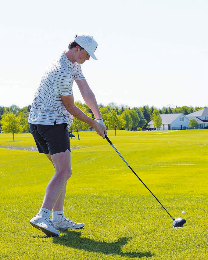 North Border golfer, Bjorn Evenson, takes a swing at state golf. Photo by Larry Stokke.