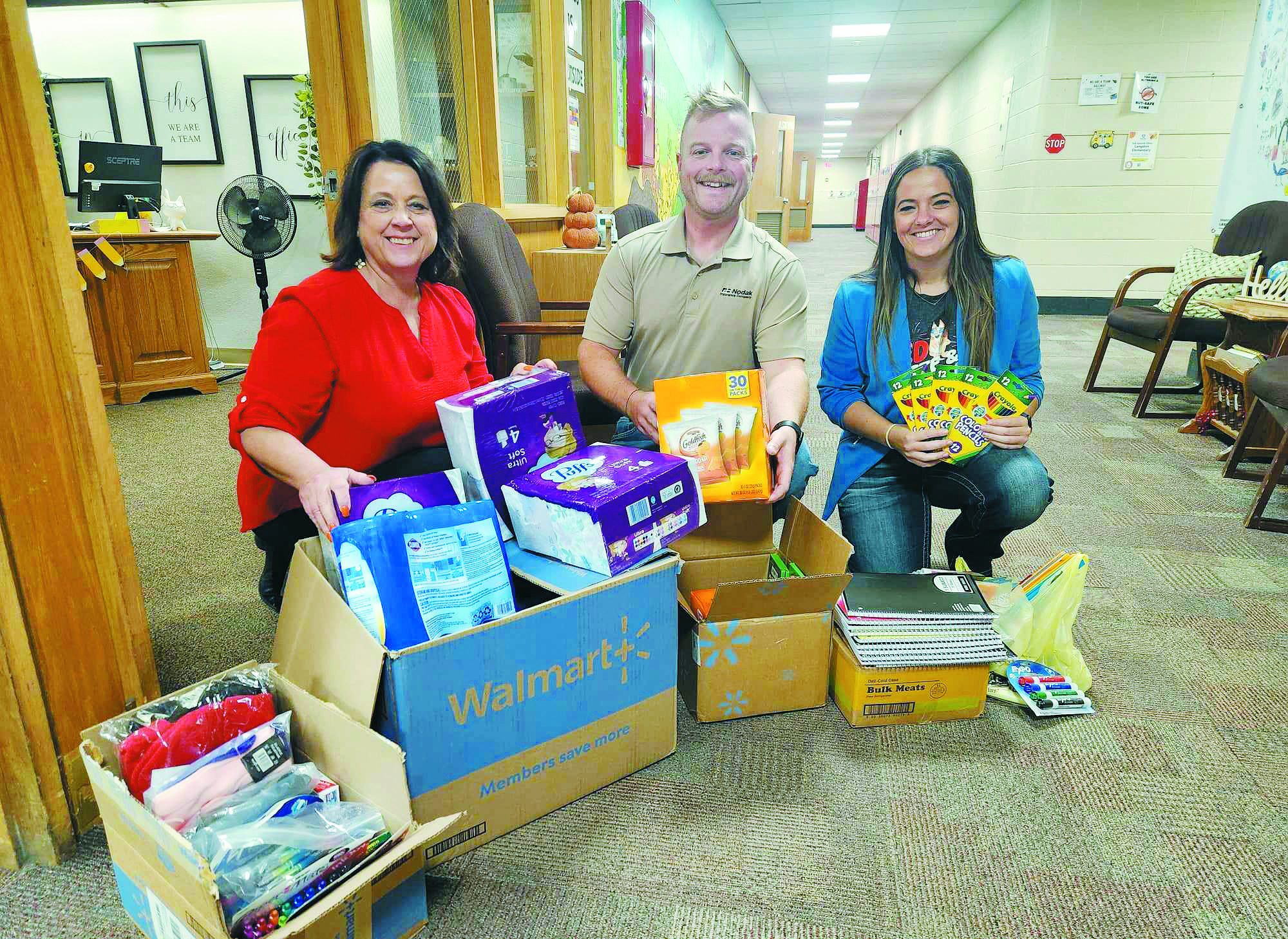 From left to right, LeeAnn Charon, Ryan Beattie, and Jayce Bata at Langdon Elementary School on Sept. 17. Photo by Hilary Nowatzki.