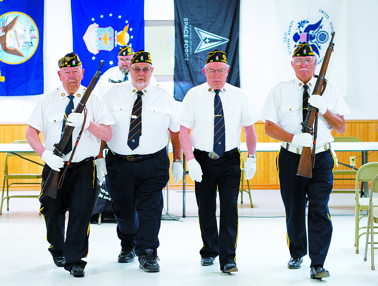 The Post 98 Color Guard opened the program (L-R) Harvey Metzger, Dennis Hansel, Larry Murie, and Leon Hiltner. Photo by Larry Stokke.