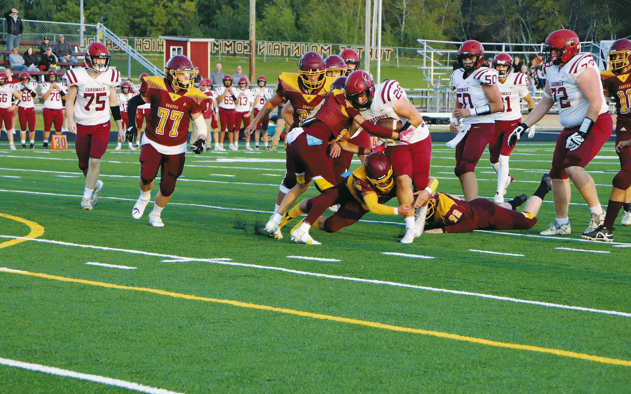 Theo Romfo (#28), makes a nice gain. Also on the play are Keaton Ullyott (#75), Landon Schneider (#50), Tanner McDonald (#81), and Jacob Lowery (#72). Photo courtesy of Turtle Mountain Times.