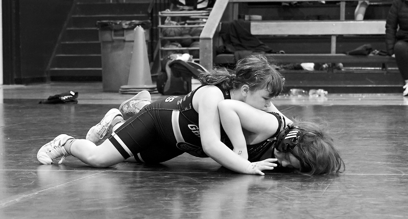 Danika Blair gets Chase Henke down on the mat. Photo by Larry Stokke.
