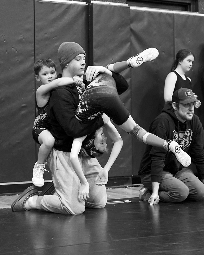 Liam Werven gets double teamed. Photo by Larry Stokke.