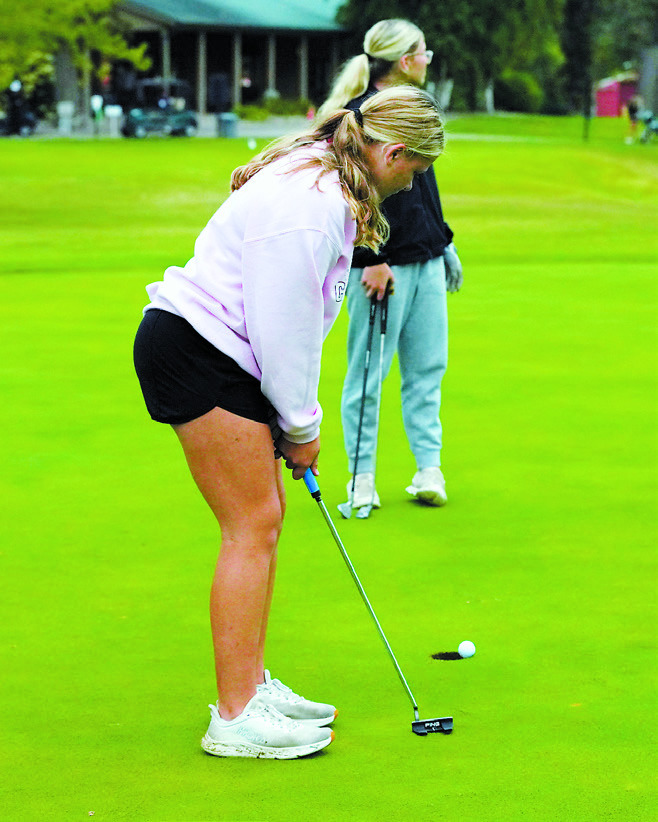 Colby Forest drops one in the cup, finishing the meet in Grafton with a score of 103. Photo by Larry Stokke.