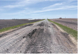 Heavy truck traffic and increased vehicle volumes during the Highway 1 construction project have contributed to deteriorating conditions on some township roads, prompting concerns from local officials and residents. Submitted photo