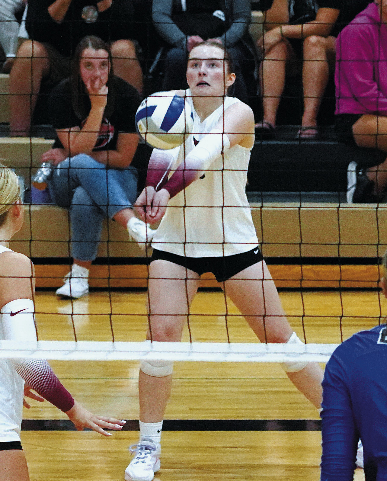 Meredith Romfo with a backrow dig in the Cards win over the Hillsboro-Central Valley Burros. Photo by Larry Stokke.
