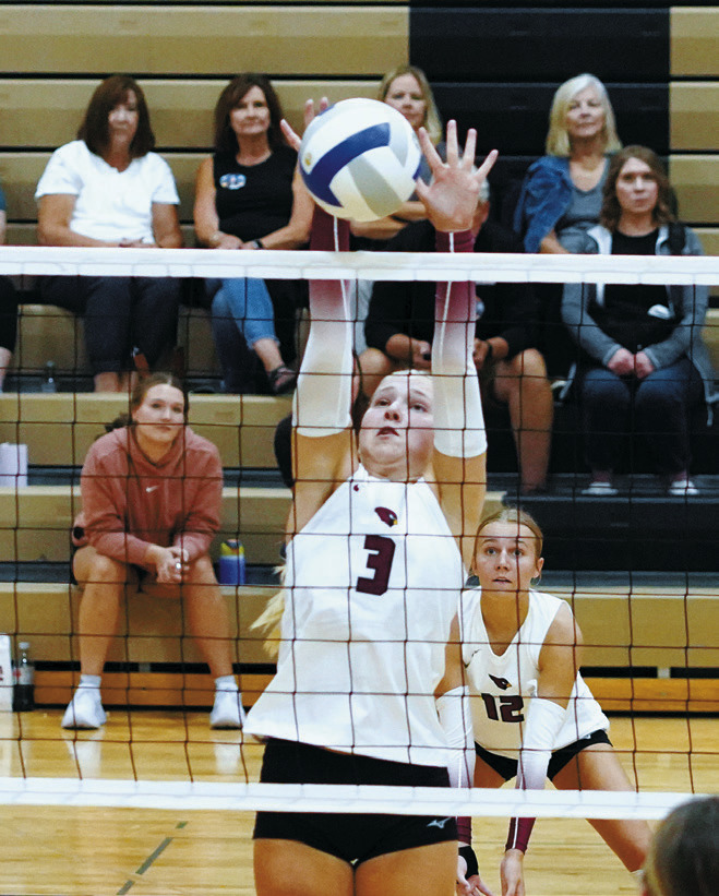 Payton Hall stuff blocks a Hillsboro-Central Valley player in the Northern Cass Tournament. Photo by Larry Stokke.