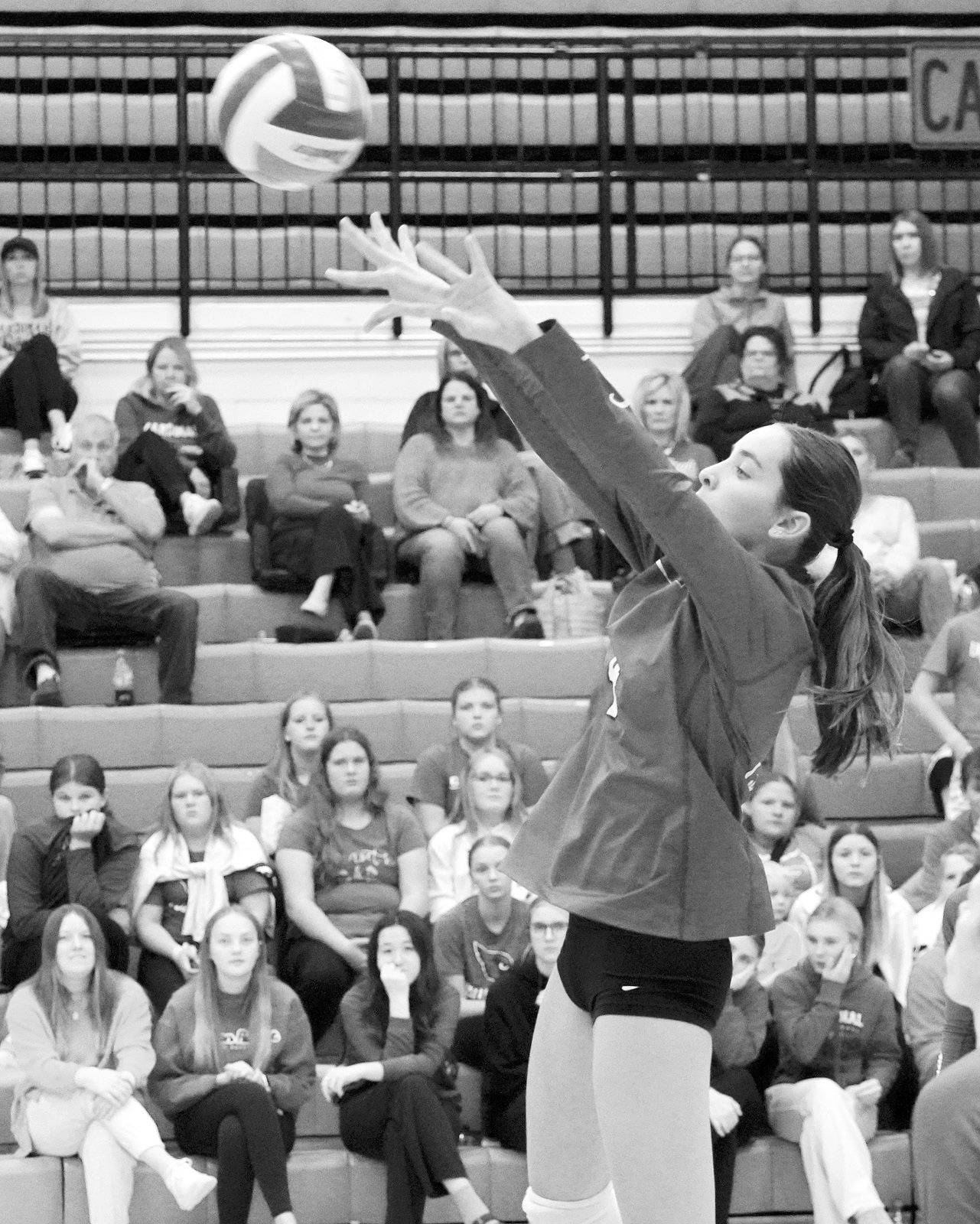 Avery Lorenz sends the volleyball over the net for a kill. Photo by Larry Stokke.