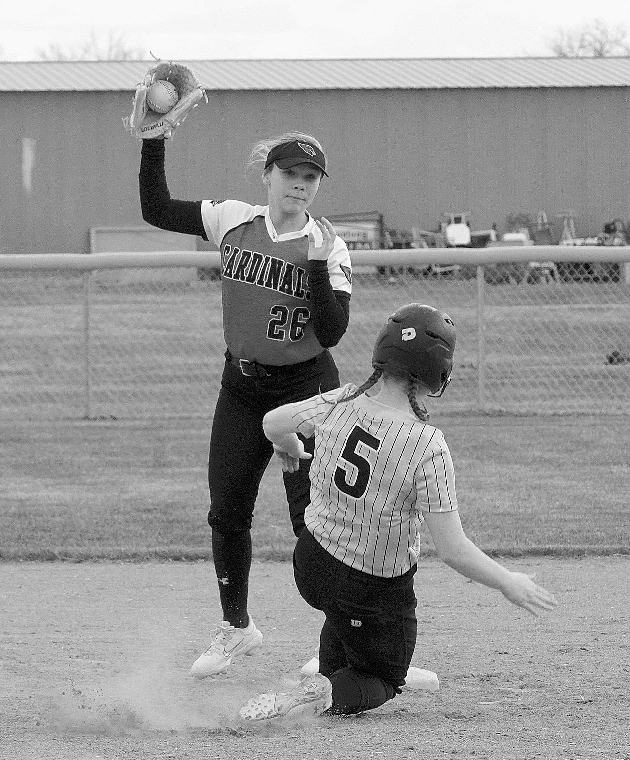 Raeleigh Ratzlaff catches the ball in time for an out against the Grizzlies. Photo by Larry Stokke.